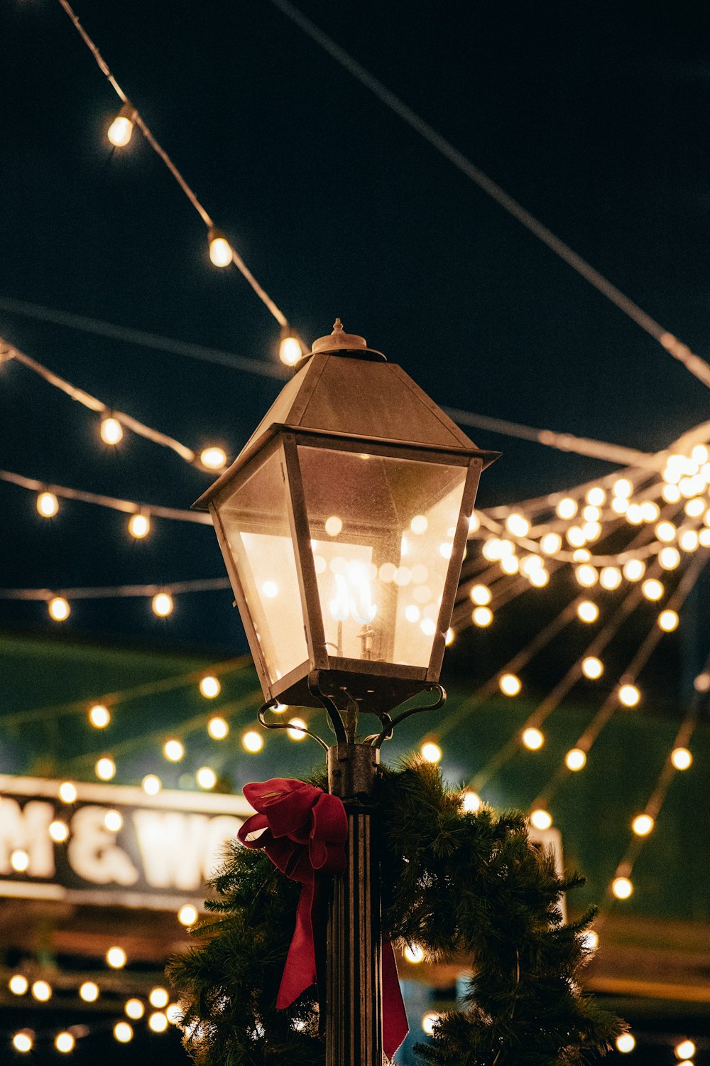 a street light with a wreath on top of it