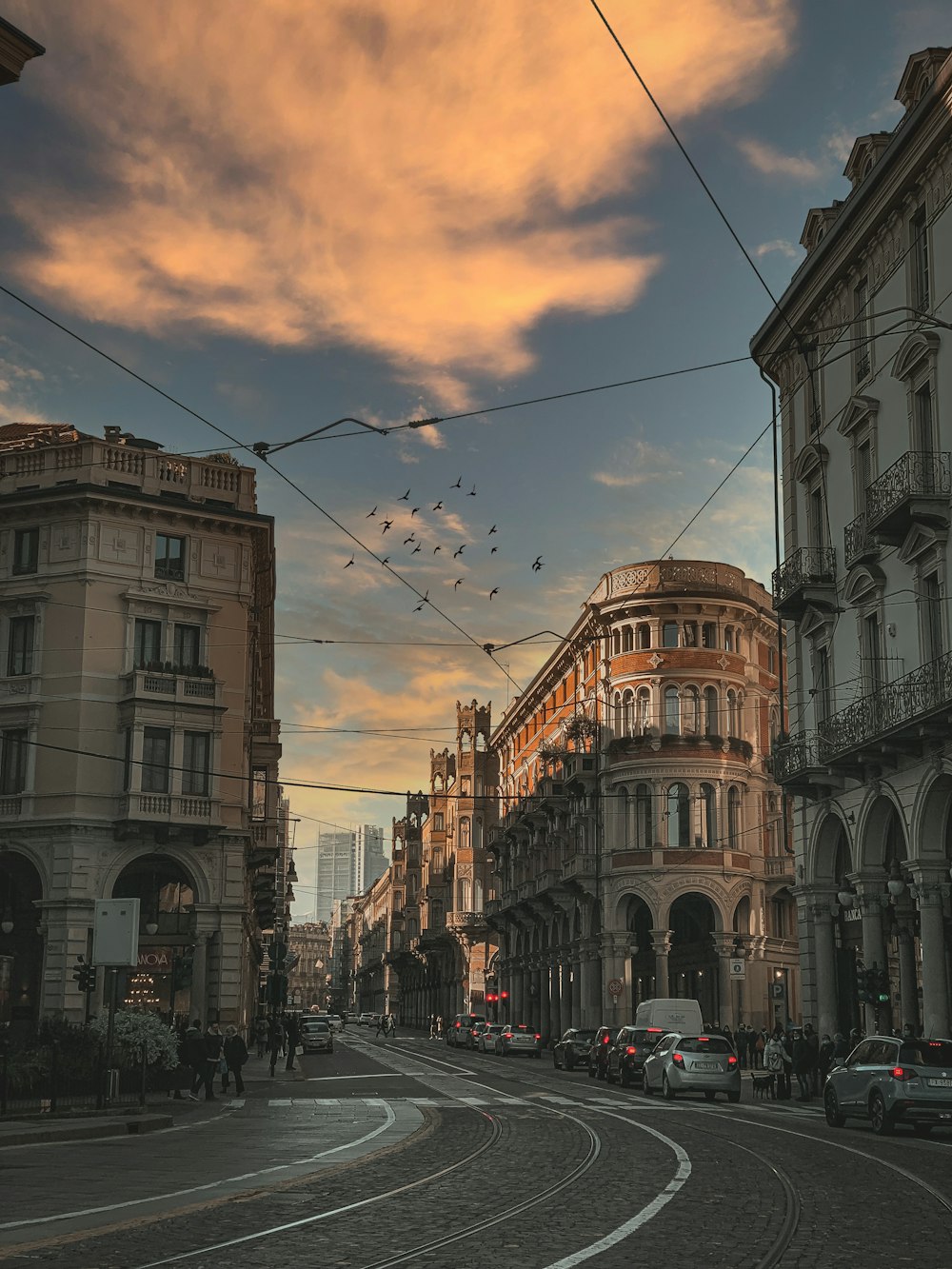 a city street with a bunch of cars parked on the side of it