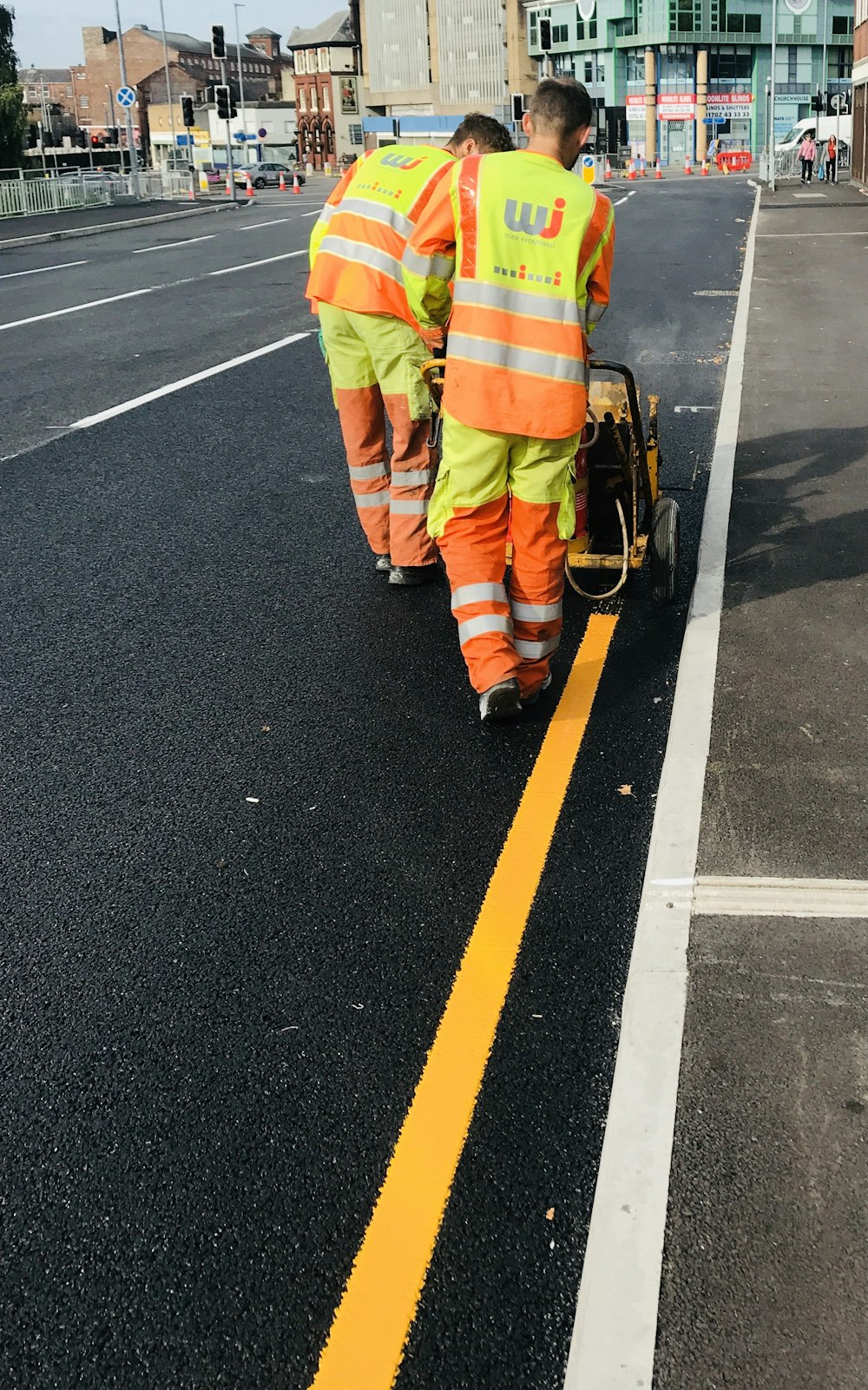 a couple of men that are standing in the street