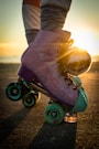 a person riding a skateboard on a road