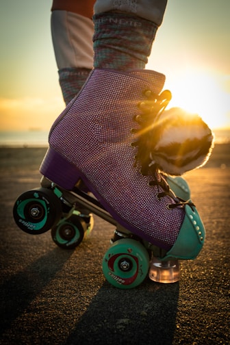 a person riding a skateboard on a road