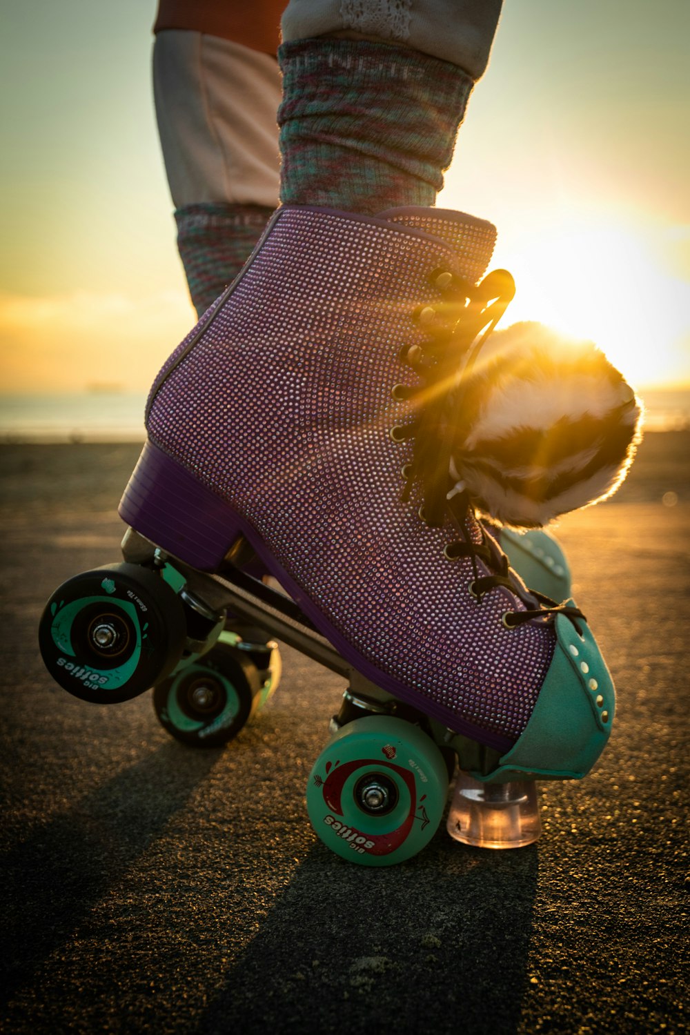 a person riding a skateboard on a road