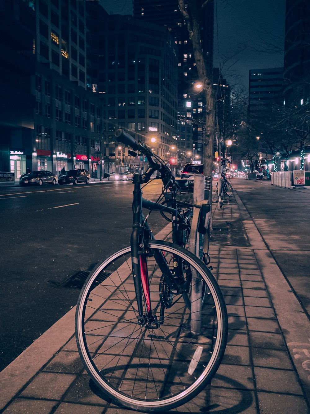 a bicycle parked on the side of a street