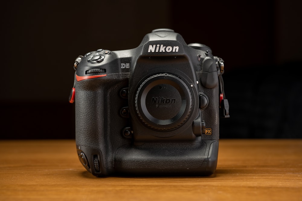 a camera sitting on top of a wooden table