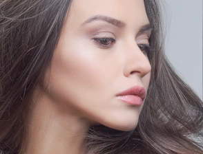 a close up of a woman with long hair