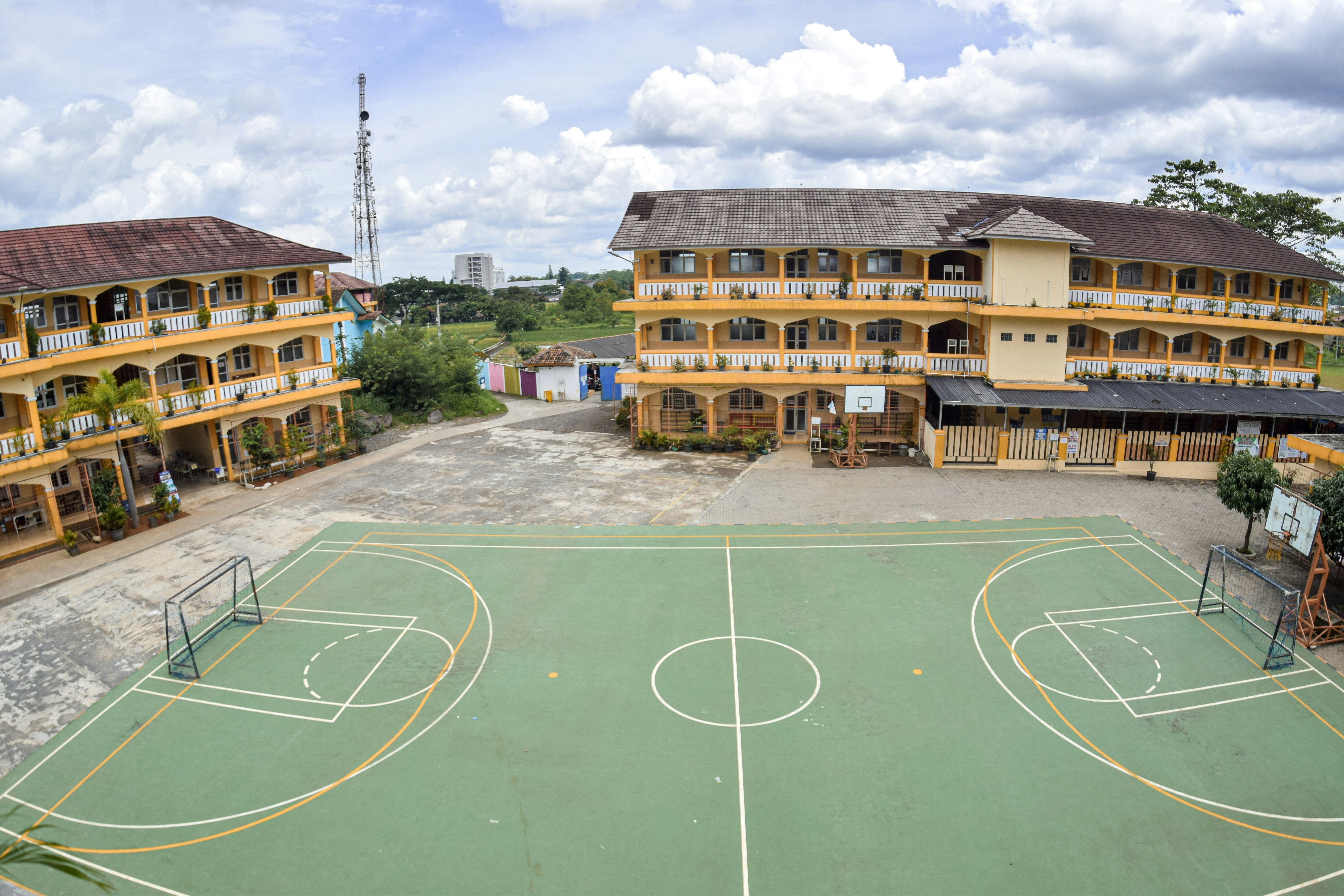 a basketball court in front of a building