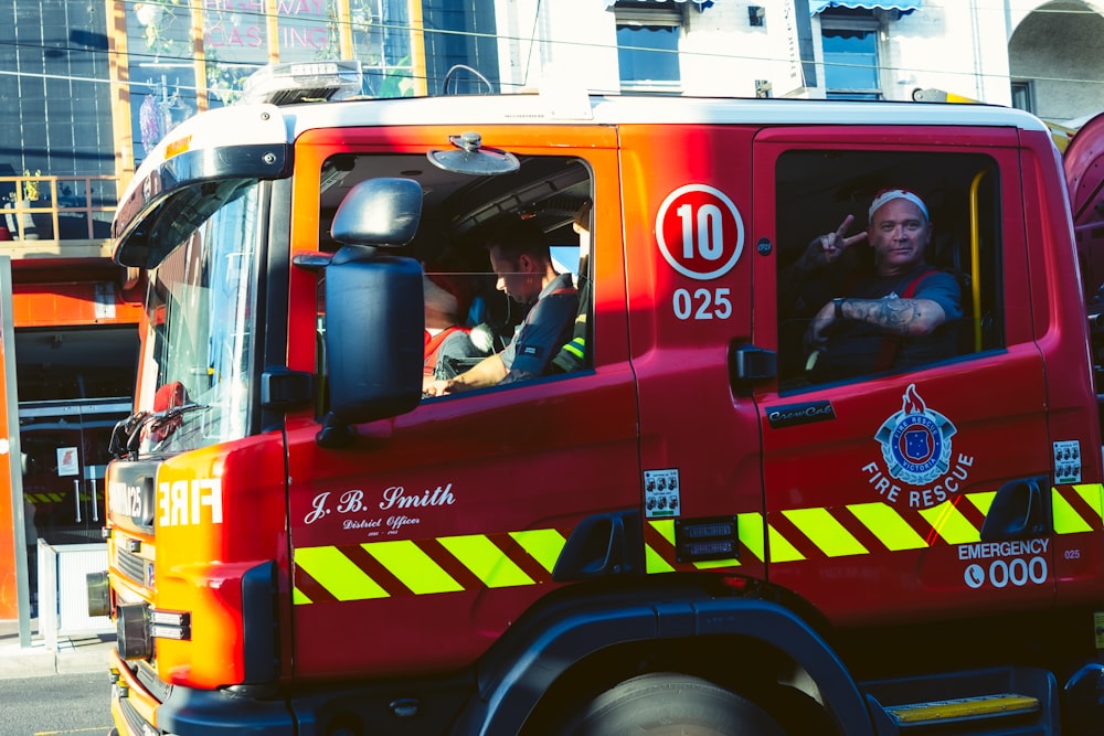 a fire truck driving down a city street