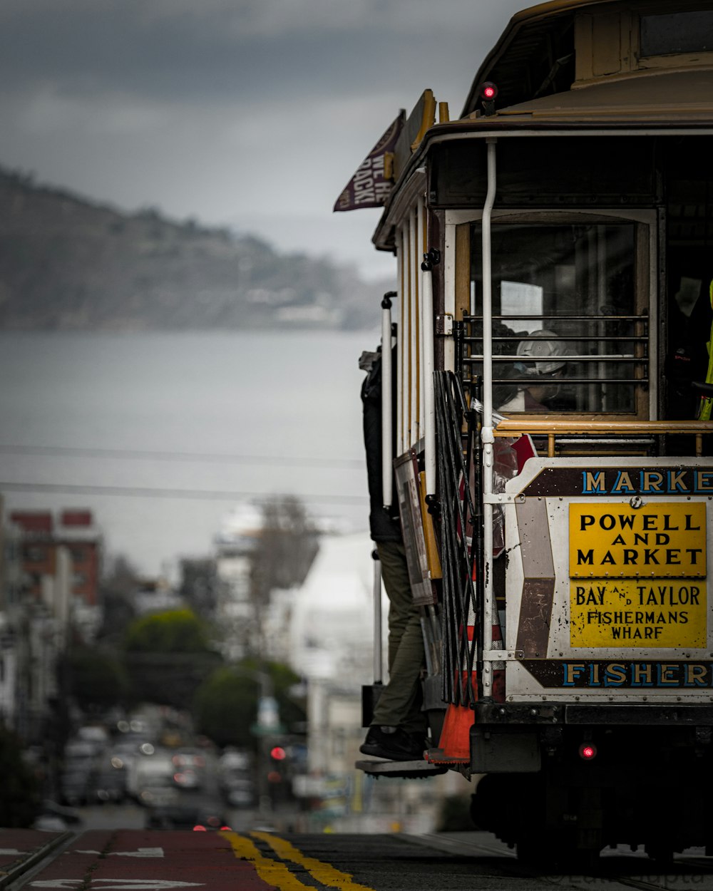 a cable car with a sign on the side of it