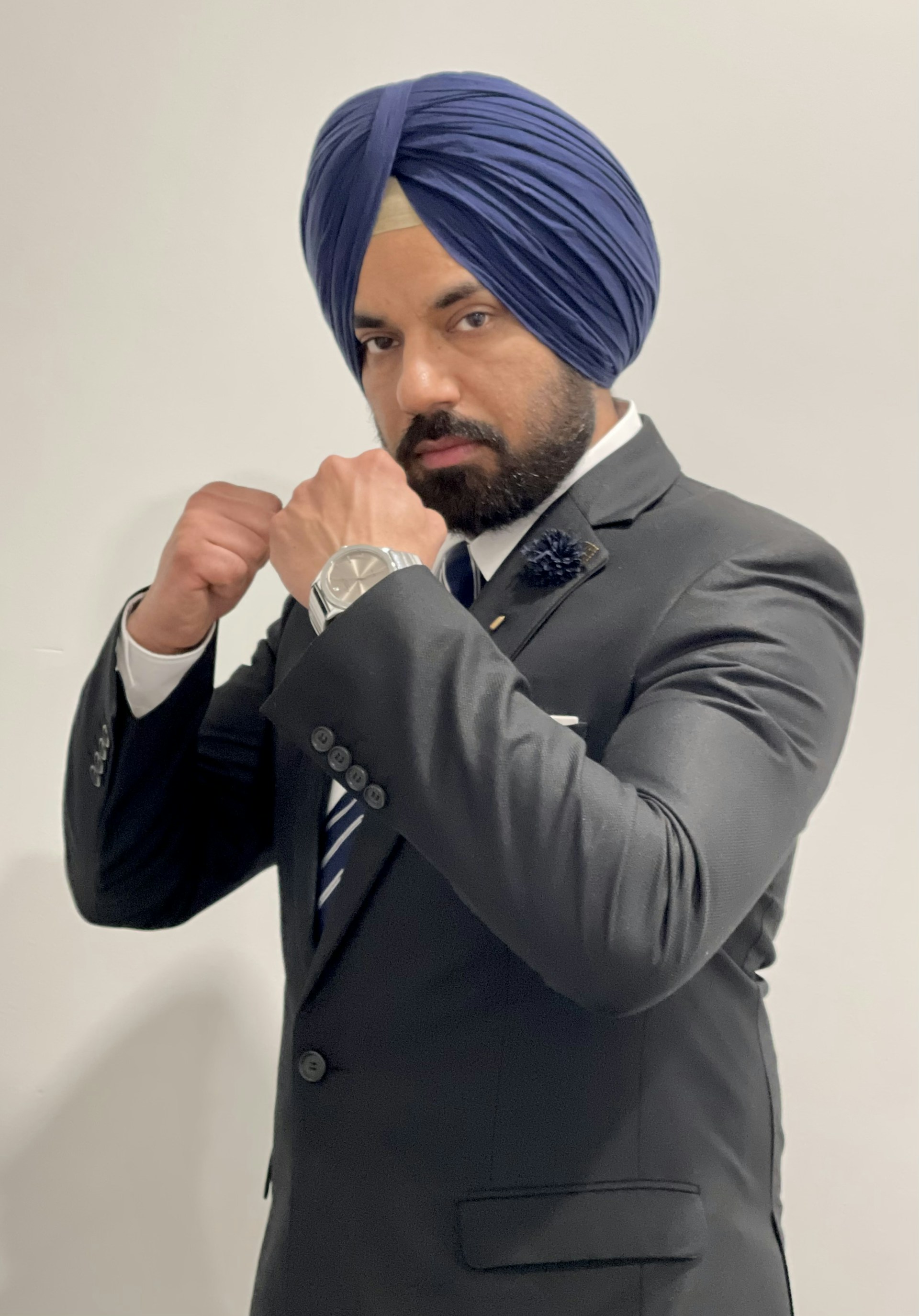 Sudhanshu Jha standing confidently in front of the Gujarat High Court, symbolizing his dedication to justice and legal integrity.