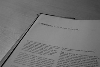 a close up of an open book on a table