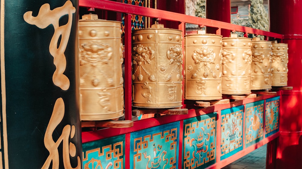 a bunch of bells that are on a wall