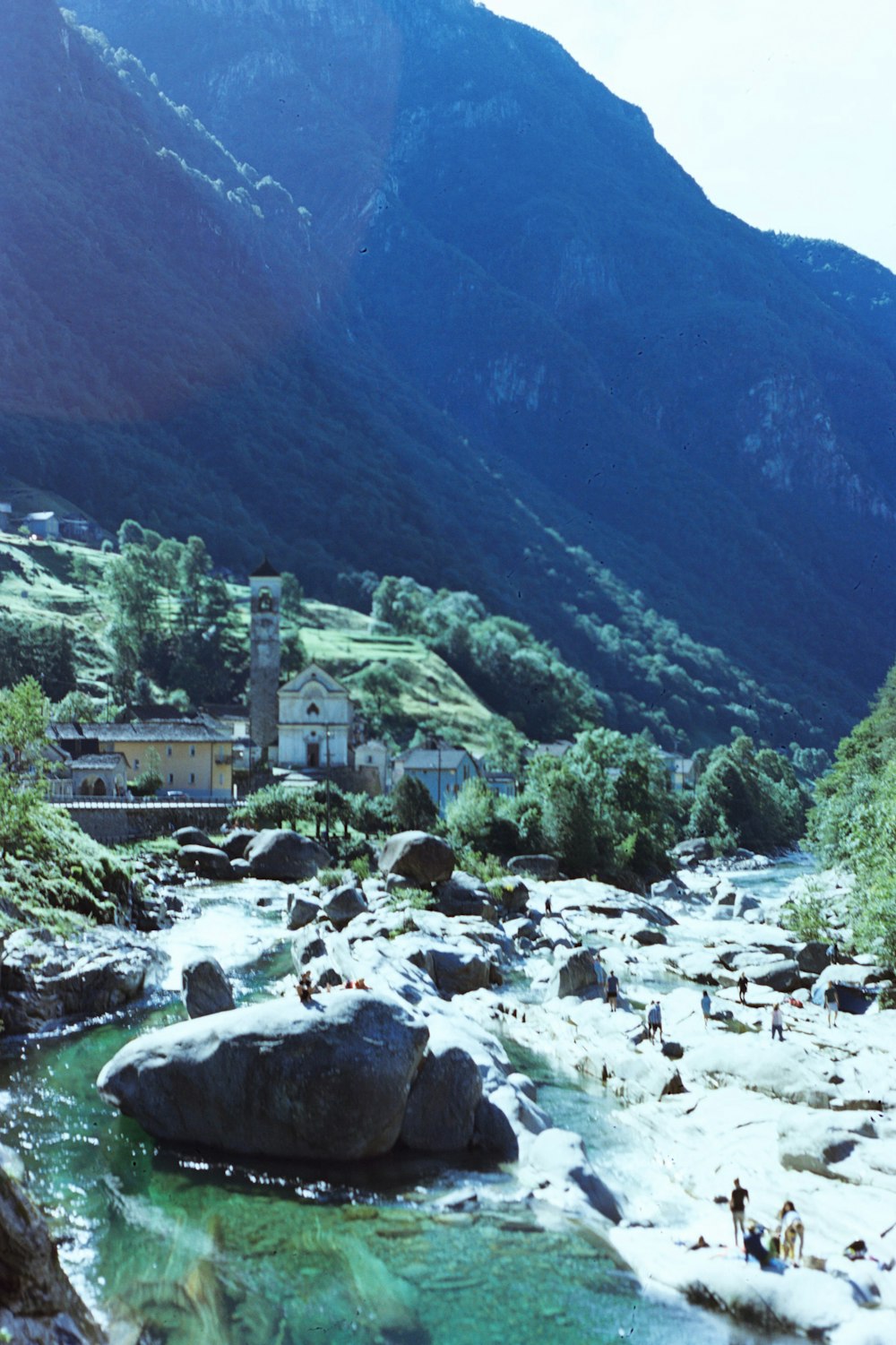 a river running through a lush green valley