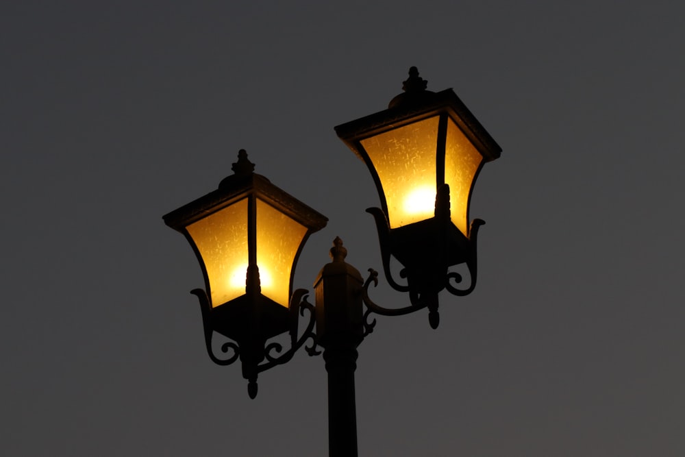 a couple of street lamps sitting next to each other
