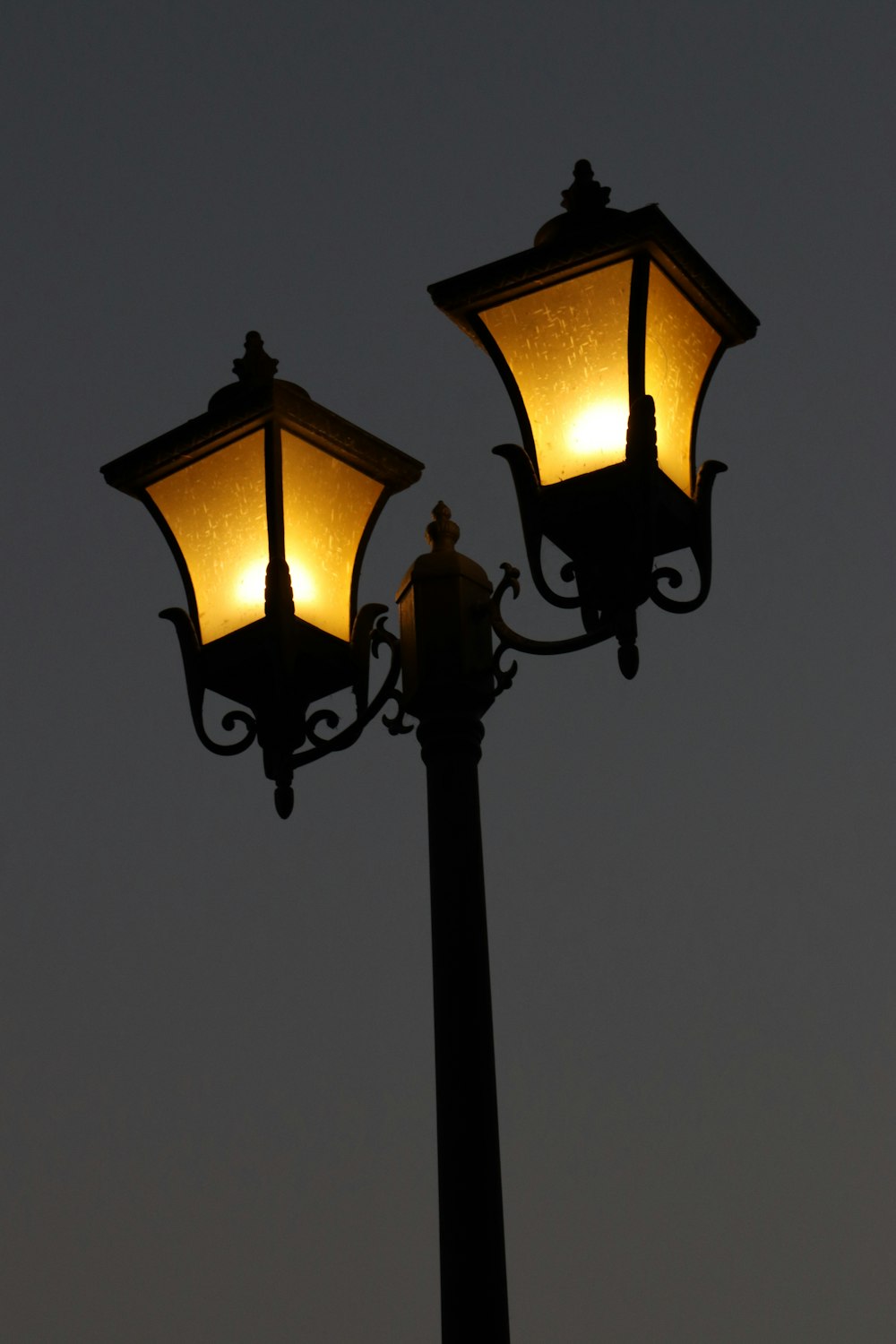a couple of street lamps sitting next to each other