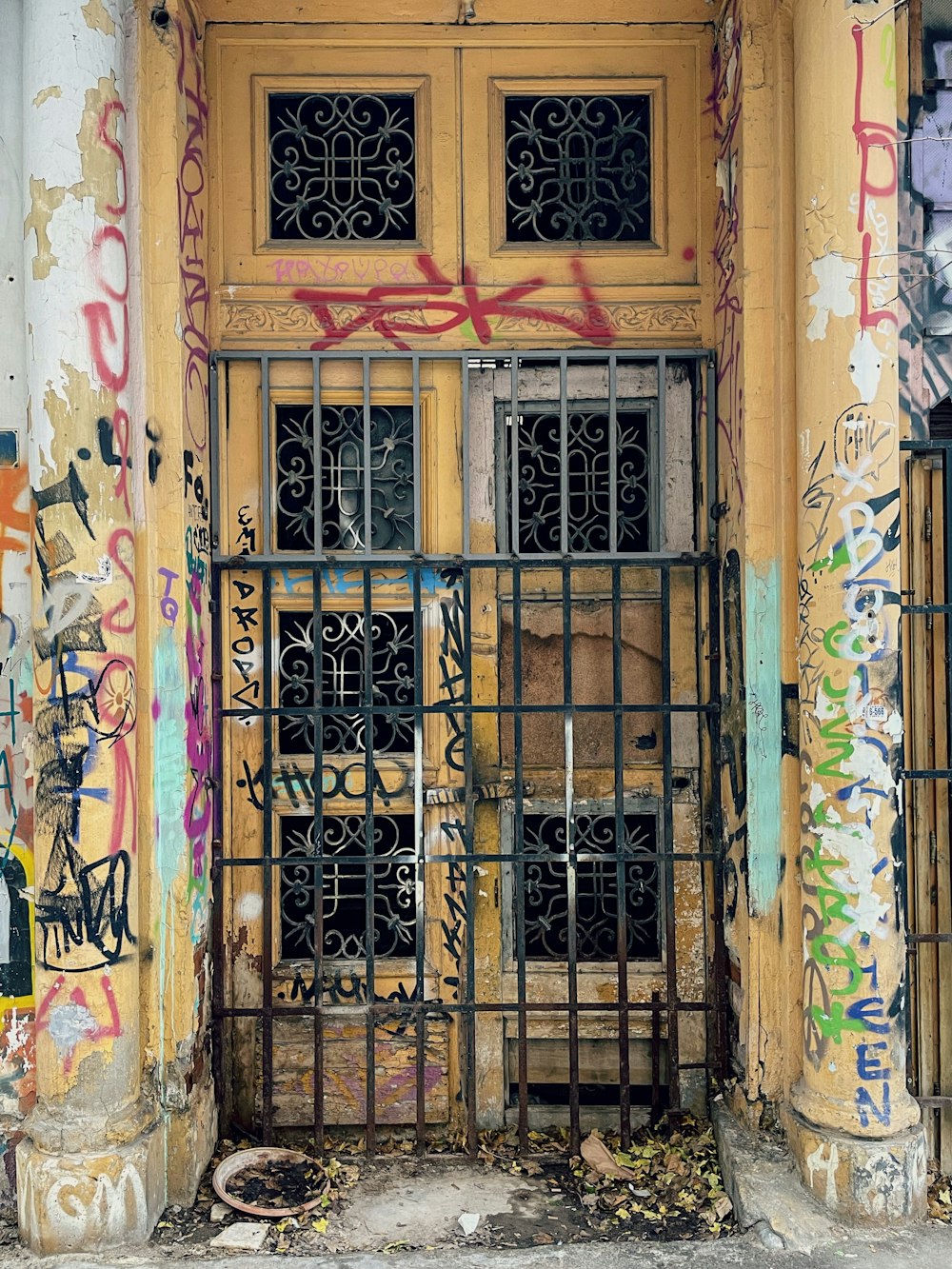 an old building with a bunch of graffiti on it