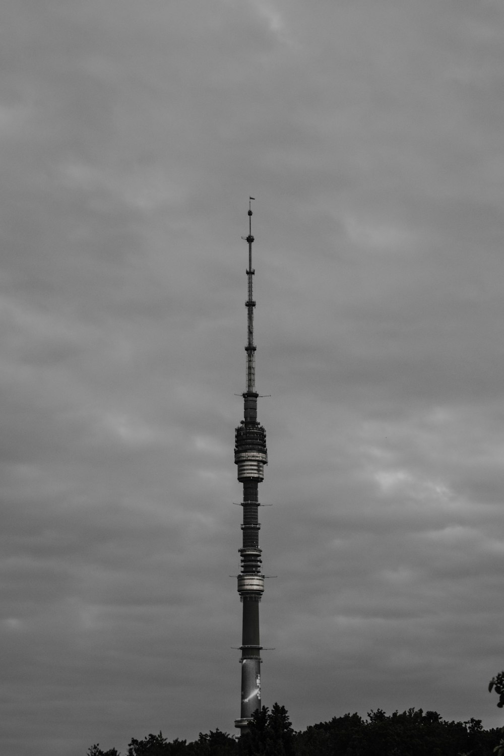 a black and white photo of a tall tower