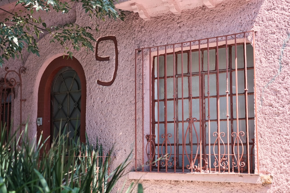 a window with bars on the outside of it