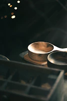 Brightly glazed plates arranged on a rustic wooden table with soft natural light.