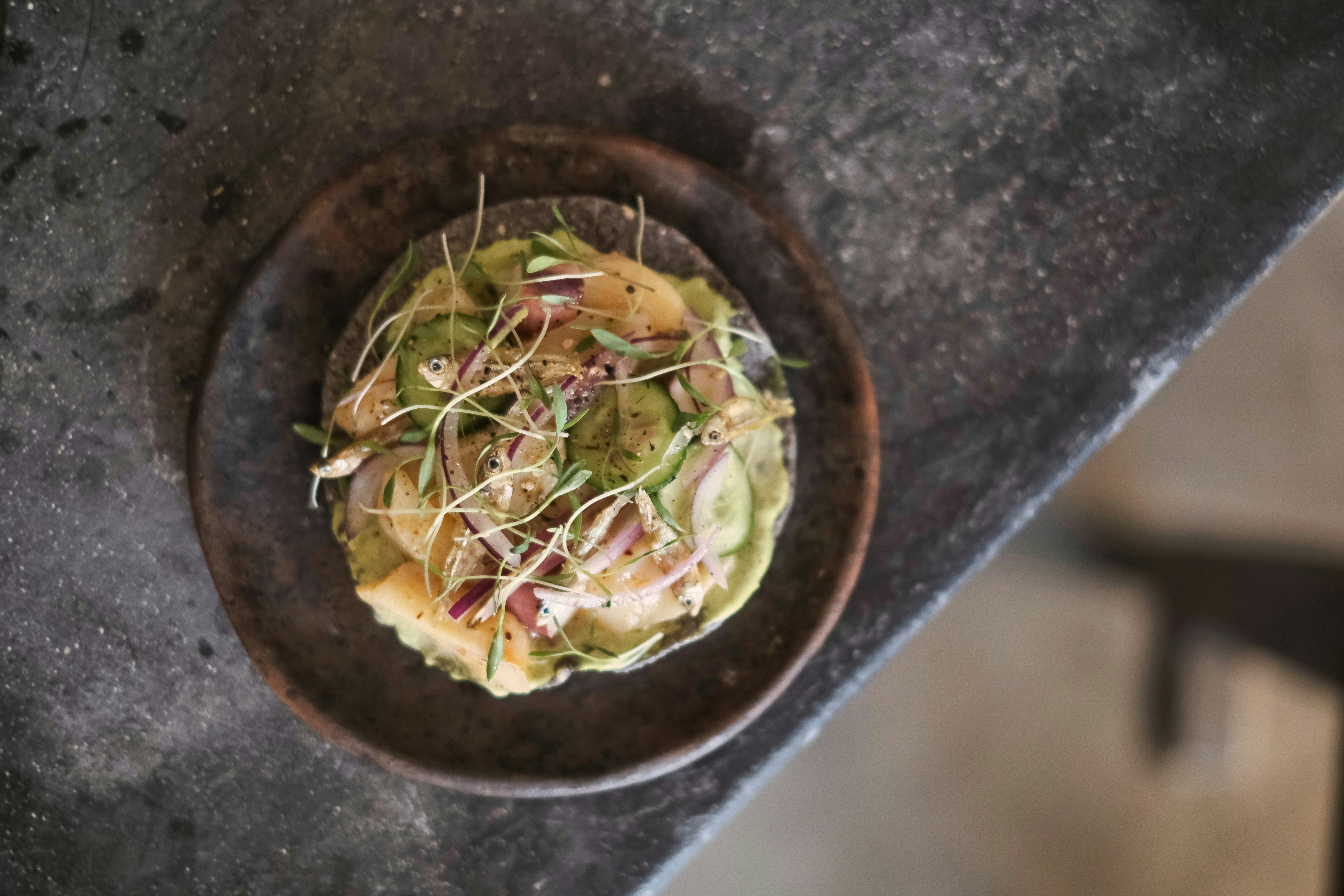 a small bowl of food on a table, Food in Mexico City