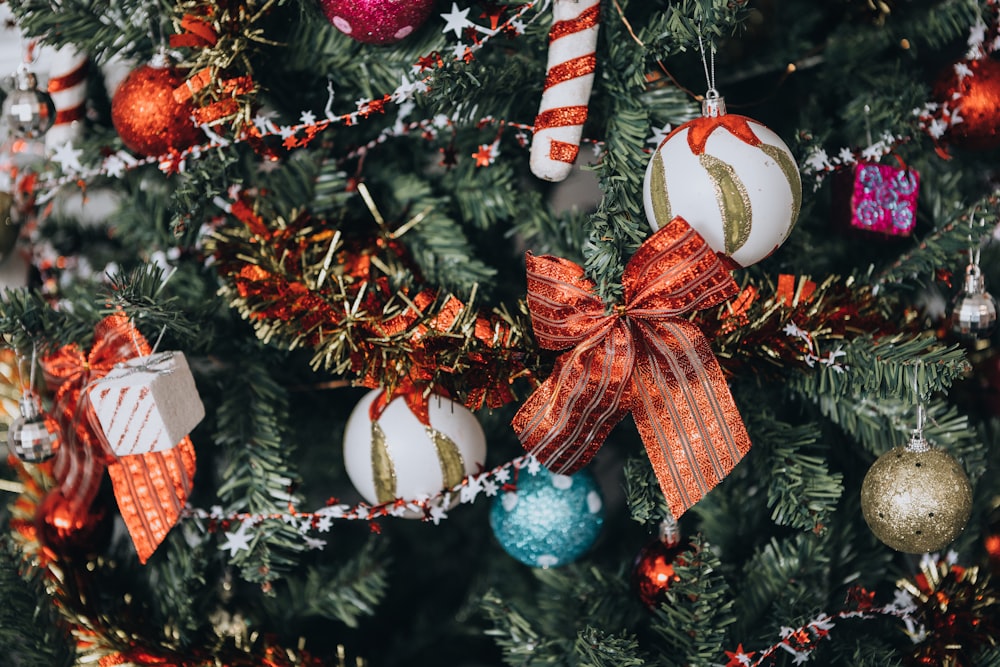 a close up of a christmas tree with ornaments