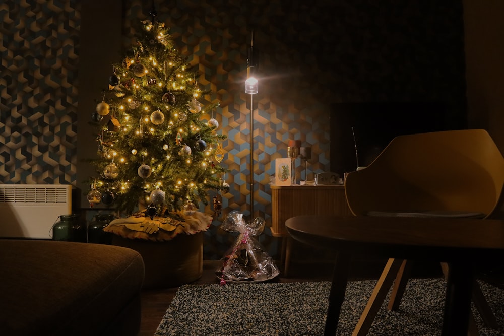 a living room with a christmas tree and a piano