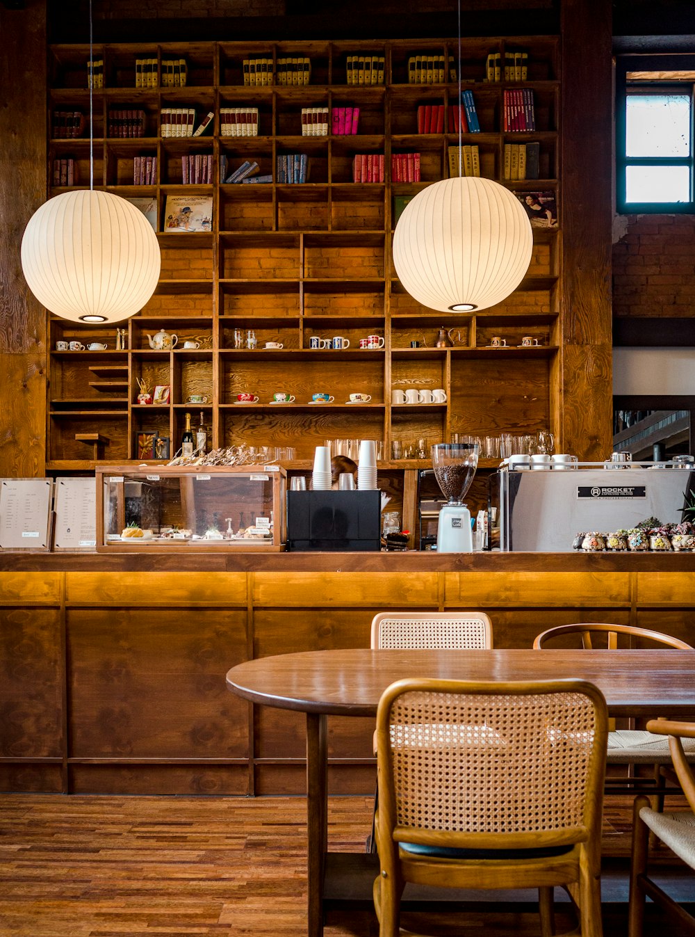 a restaurant with wooden tables and chairs