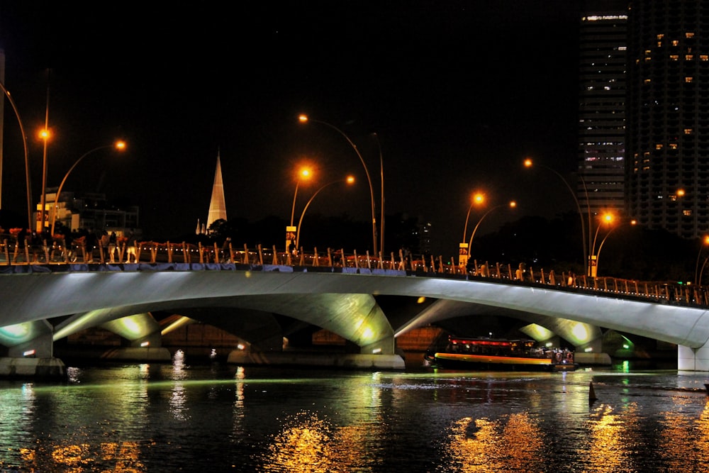 a bridge over a body of water at night