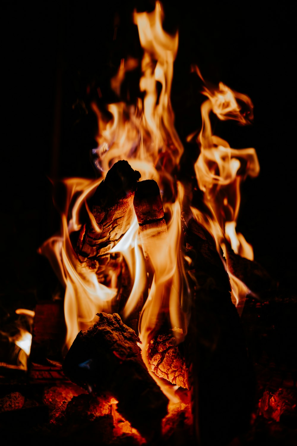 a close up of a fire in the dark