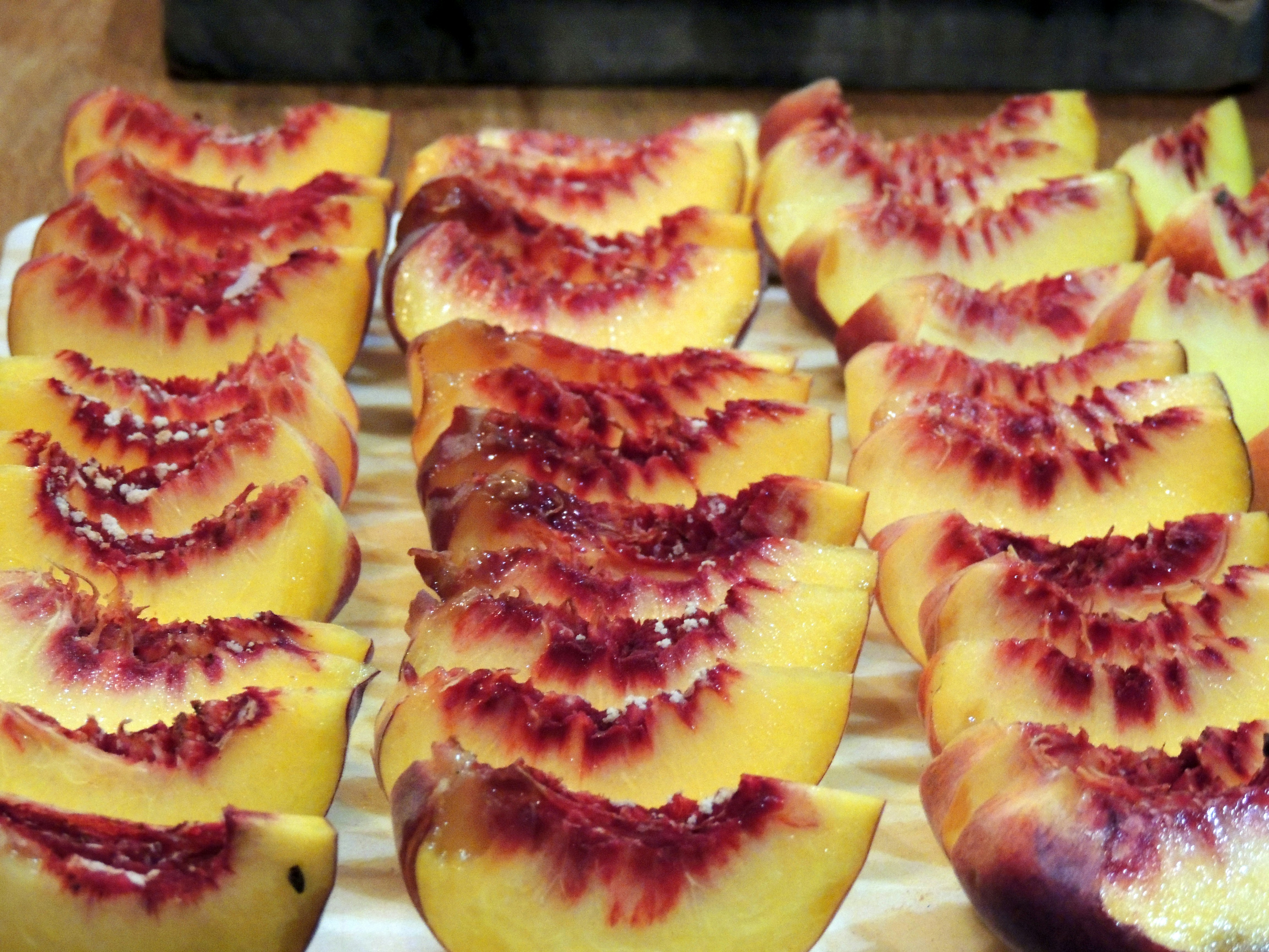 Fresh juicy peaches from Afghanistan with velvety skin and golden-pink color