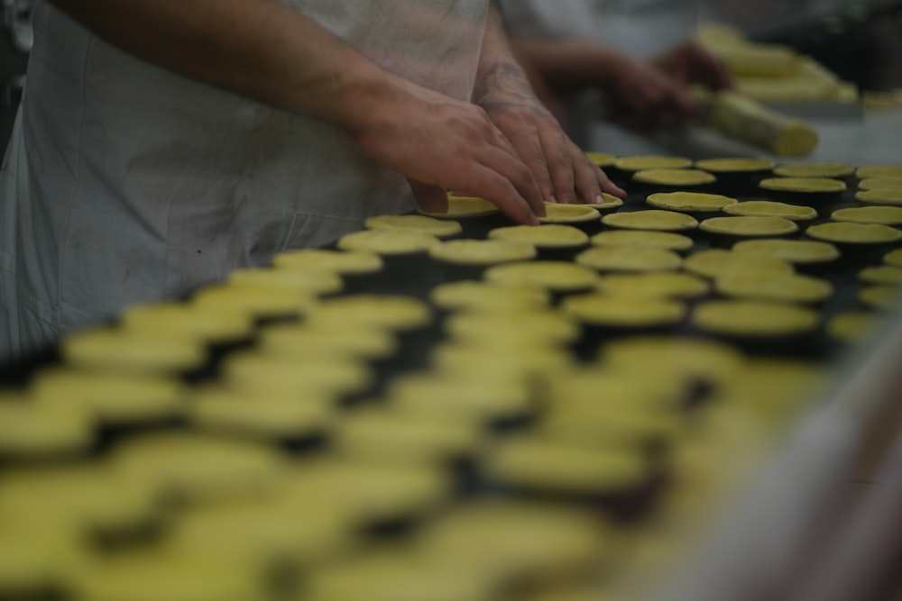 a close up of a person in a kitchen preparing food