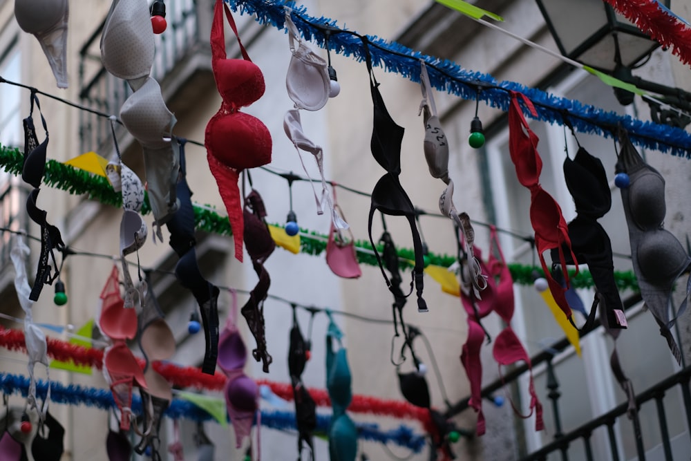 a bunch of bras hanging from a wire