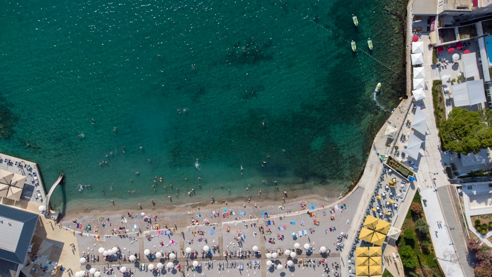 an aerial view of a beach with a lot of people