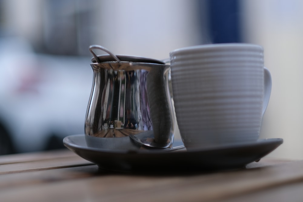 a coffee cup and saucer on a wooden table