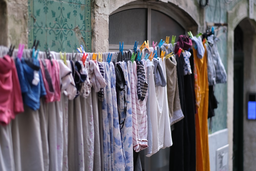 a row of clothes hanging on a clothes line