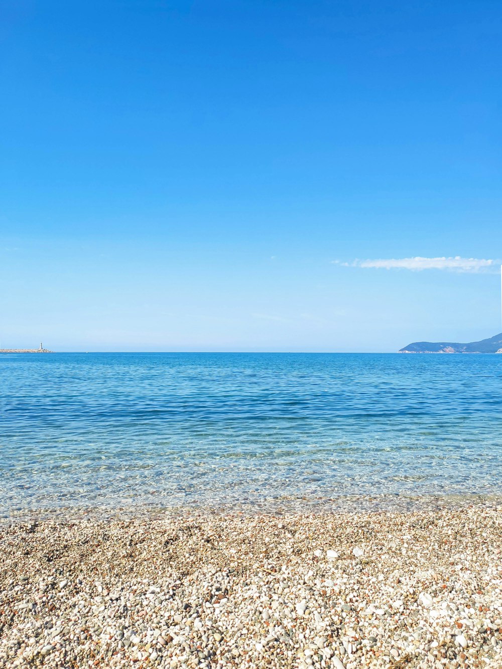 a view of a body of water from a beach