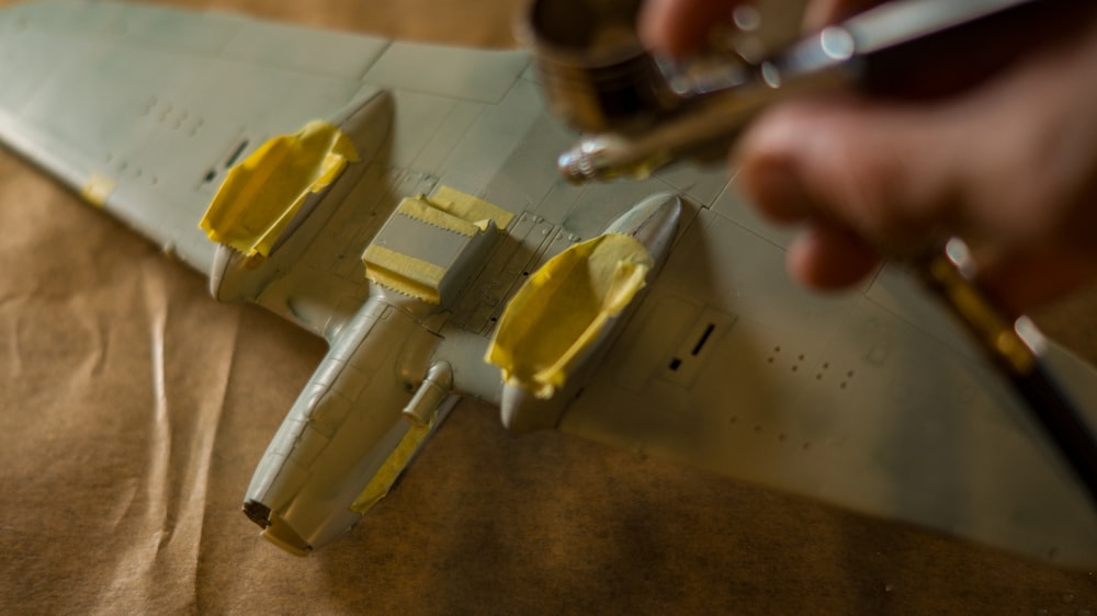 a person is working on a model airplane