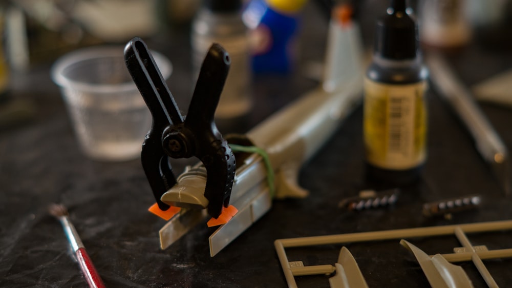 a pair of scissors and other tools on a table