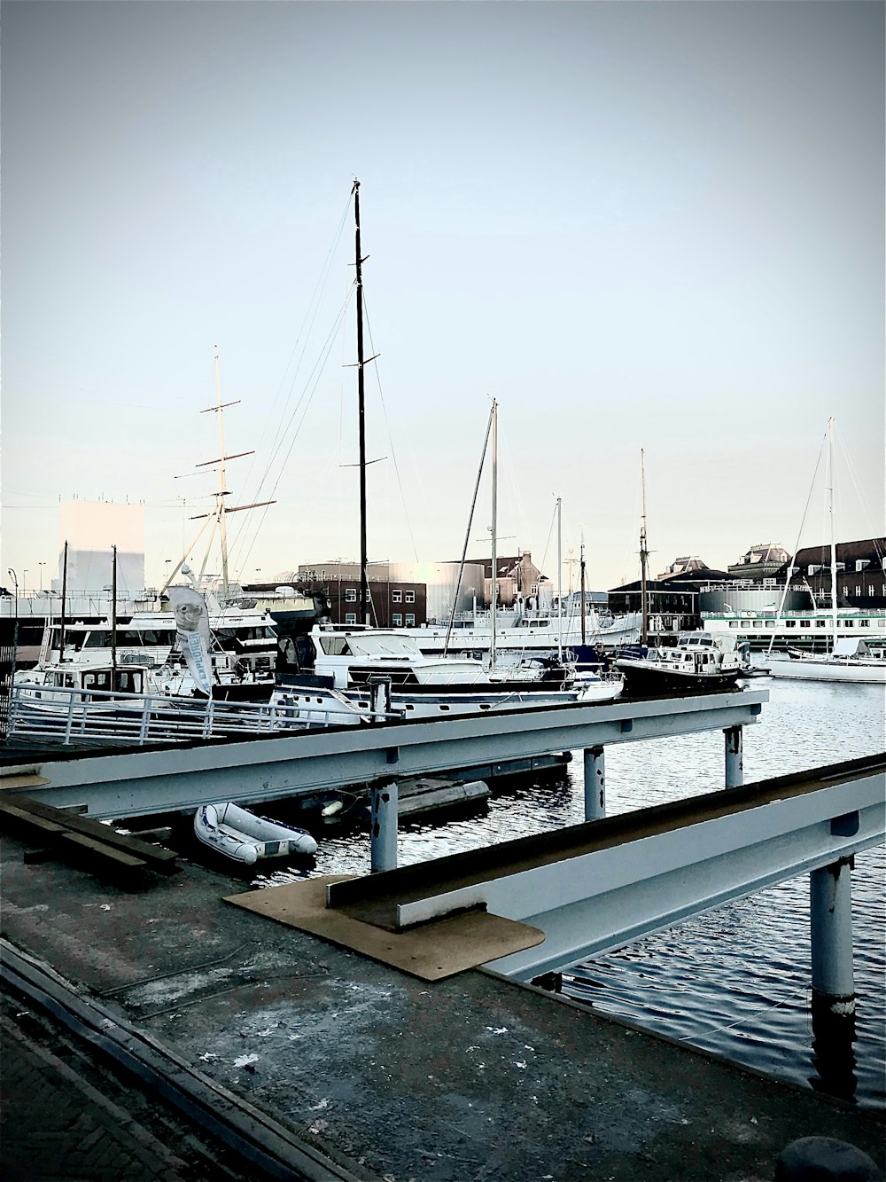 a boat dock with several boats docked in the water