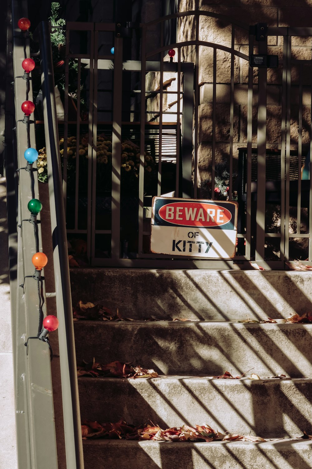 a set of stairs with a beware sign on it