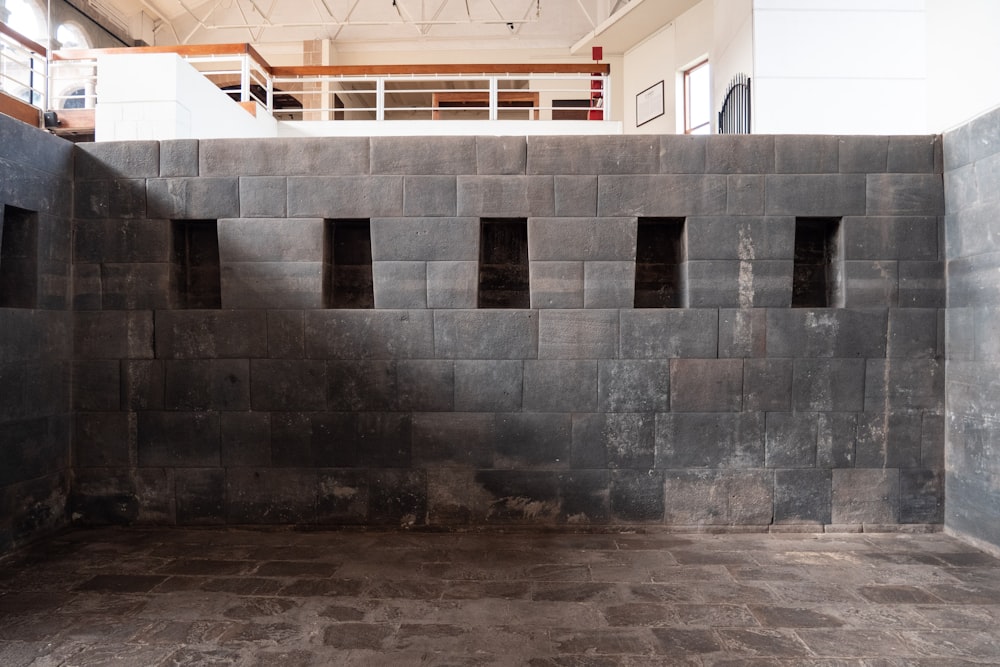 a room with a wall made out of cinder blocks