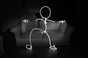 a black and white photo of a person holding a string