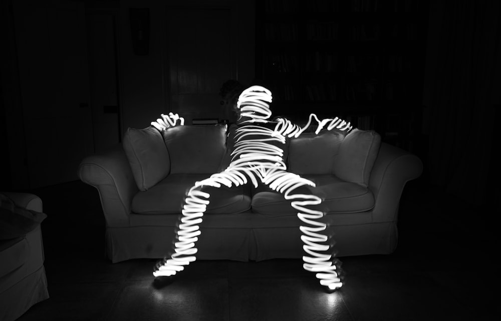 a black and white photo of a person in a living room