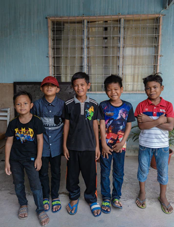 A vibrant display of boys wearing casual jeans and t-shirts in the showroom.
