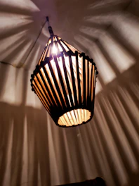 Geometric crystal lamp casting intricate shadows on a cozy room wall.