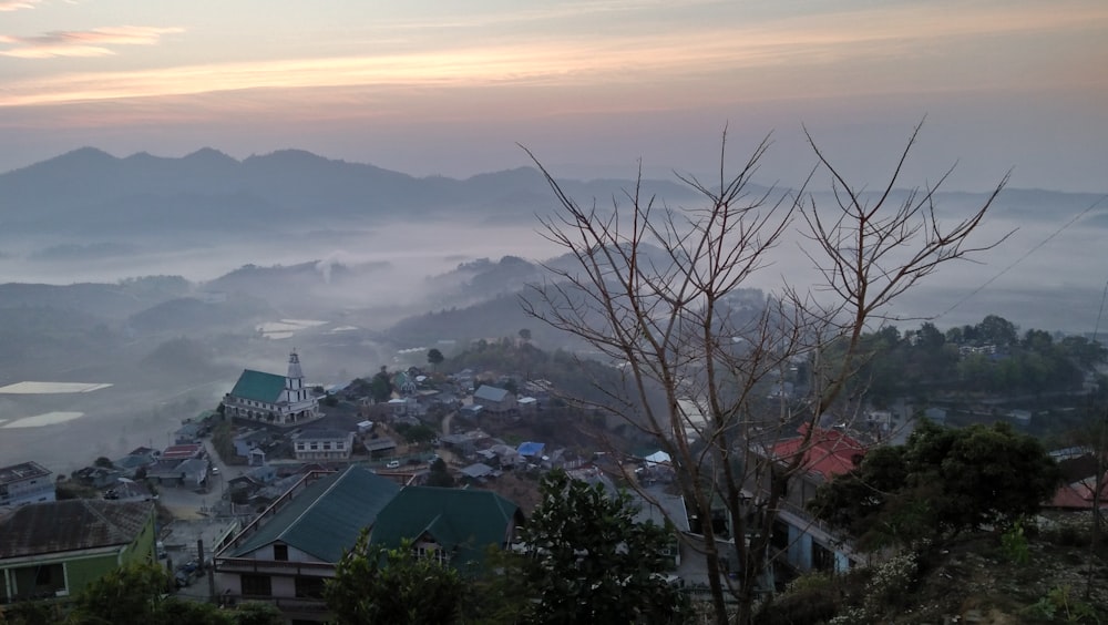 a view of a town with mountains in the background