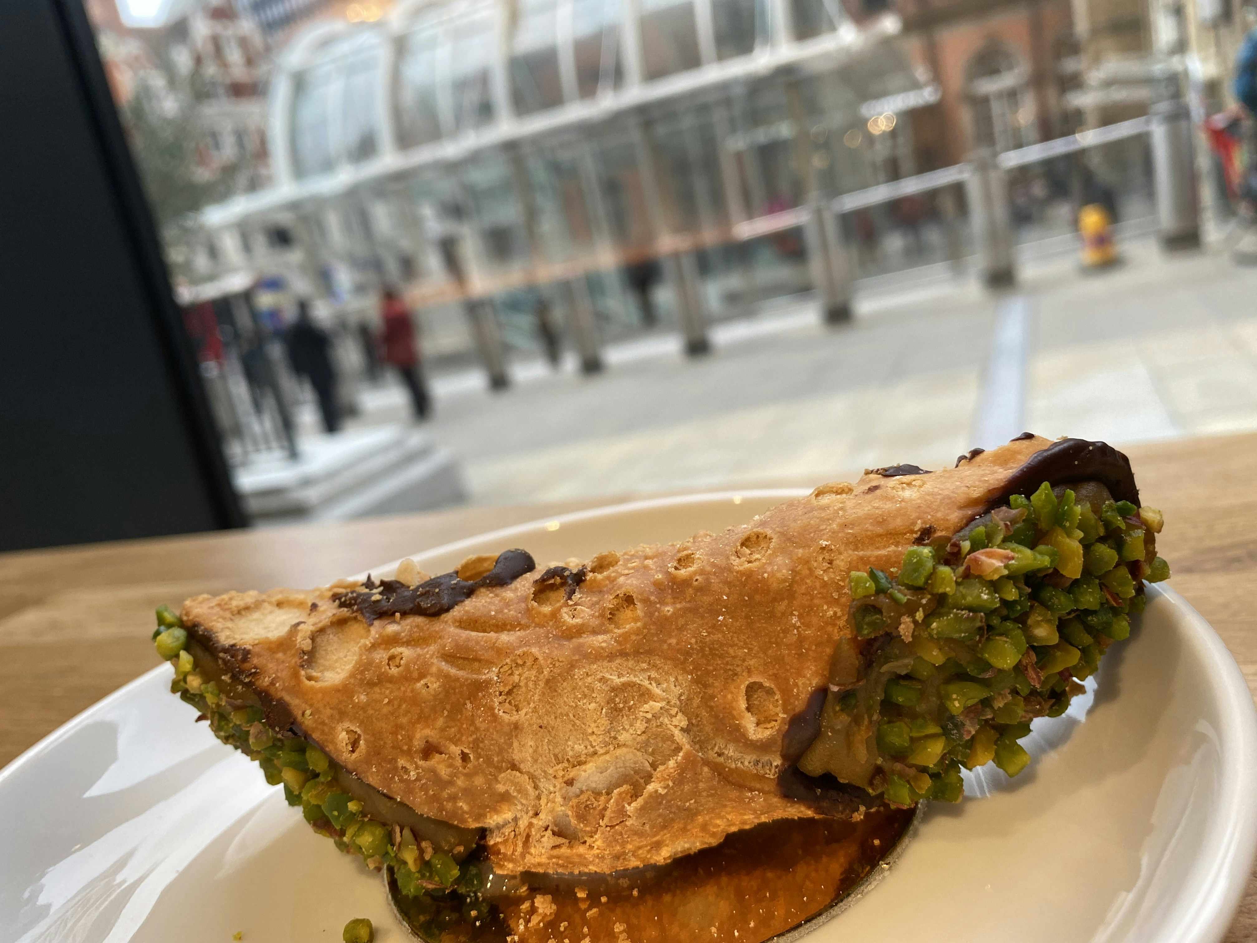 Pistachio-filled pastry on a plate