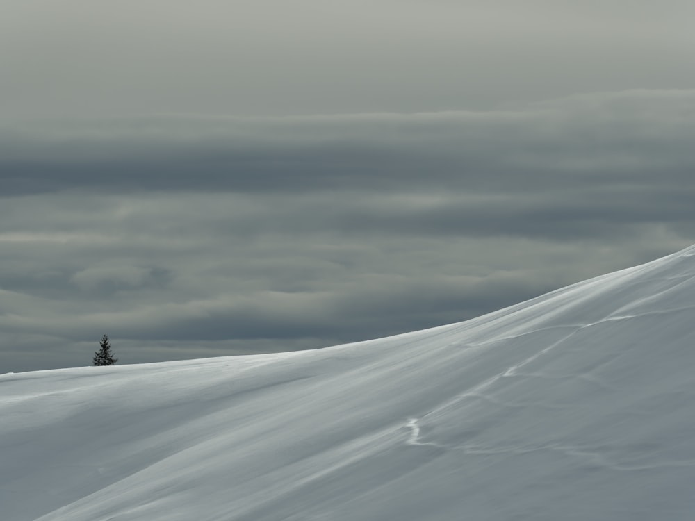 a person skiing down a snow covered slope