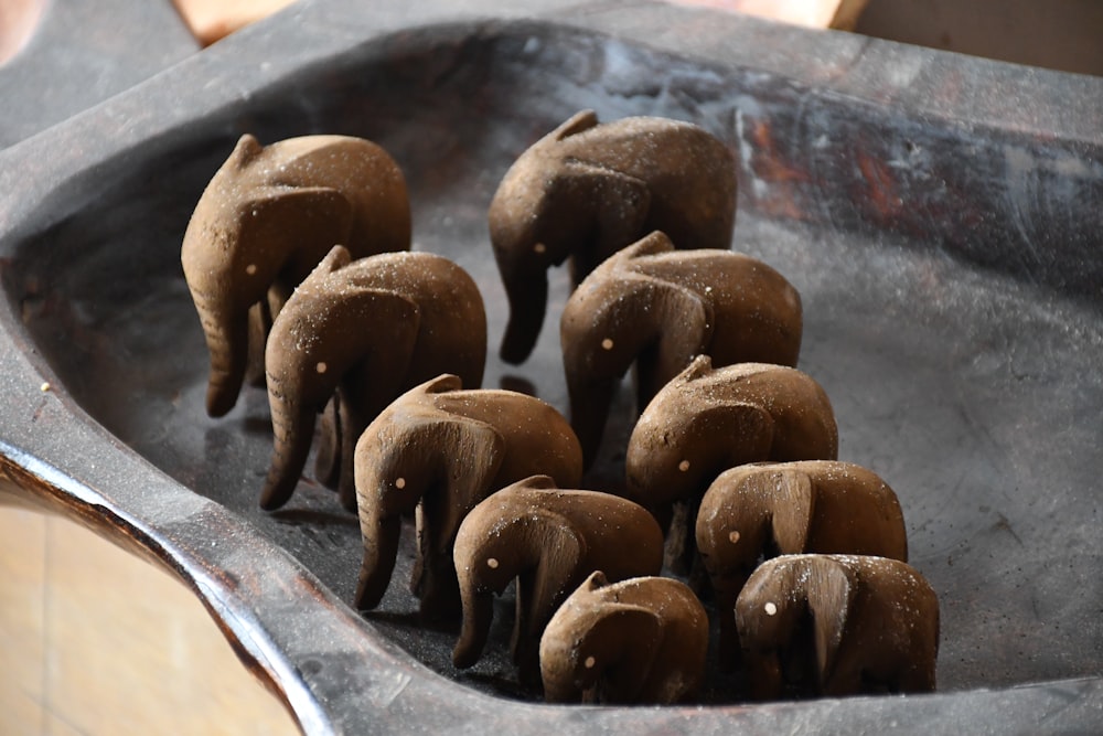 a group of elephants in a metal container