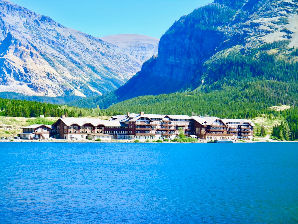 a large building sitting on the side of a lake