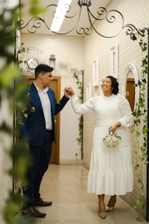 a man and a woman standing in a hallway